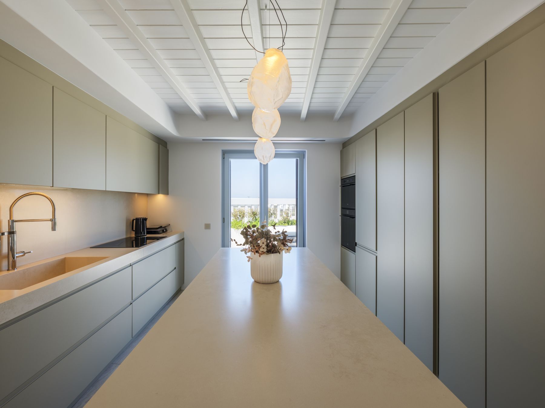 Kitchen with long island and garden doors