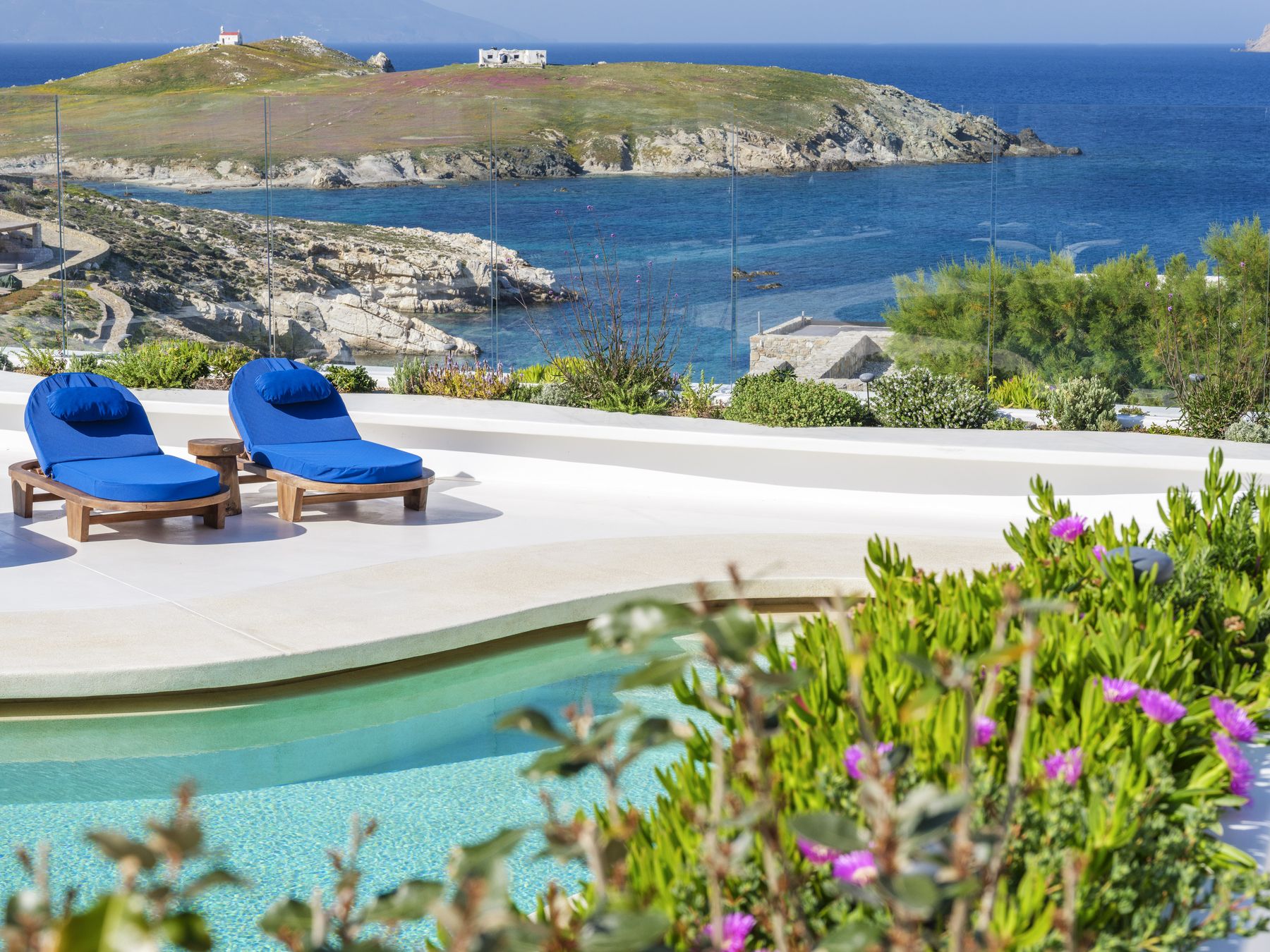 Pool edge with flowers and the island beyond